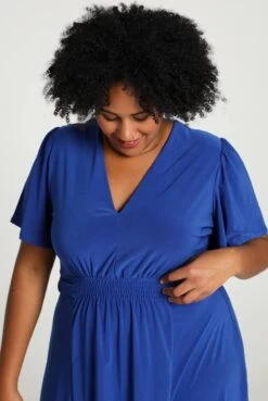 Paprika Korte, Effen Bow Jurk Met Smokwerk Op De Taille -Trendyo Trendy Winkel 803x1200 8